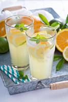 Citrus lemonade in tall glasses photo