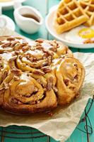 Sticky pecan buns on breakfast table photo