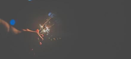 The fireworks burning sparkler in new year party night photo