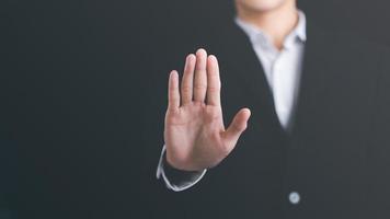 man hand stop sign, warning concept, refusal, caution, symbolic communication, preventing subsequent problems photo