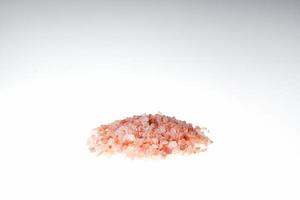 Macro photography of himalayan salt isolated on white background photo