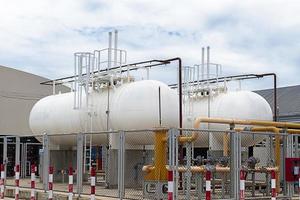 Two white fuel oil tanks are used for industrial plants. photo