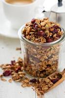 Homemade granola in a glass jar photo