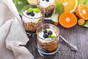 Granola breakfast parfait with citrus photo