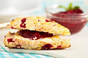 Freshly baked scones with orange zest and berries photo