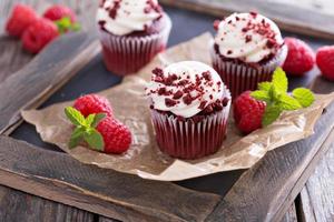 Red velvet cupcakes on parchment photo