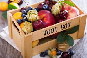 Fresh fruits in a wooden crate photo