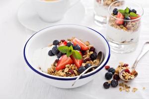 Granola with fresh berries in a bowl photo