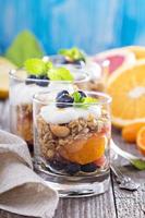 Granola breakfast parfait with citrus photo