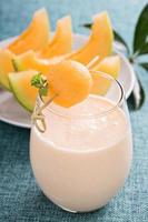 Healthy cantaloupe smoothie in a glass photo