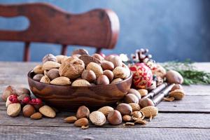 Variety of nuts with shells in a bowl photo