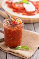 Pizza sauce in a jar selective focus photo