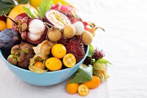 Exotic fruits on white background photo