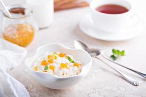 Rice pudding with dried apricots photo