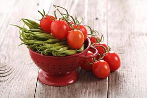 Fresh vegetables on the table, tomatoes and green beans photo
