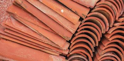 Roof tiles in a warehouse, close-up selective focus. Construction and repair of houses, delivery and sale of building materials. photo