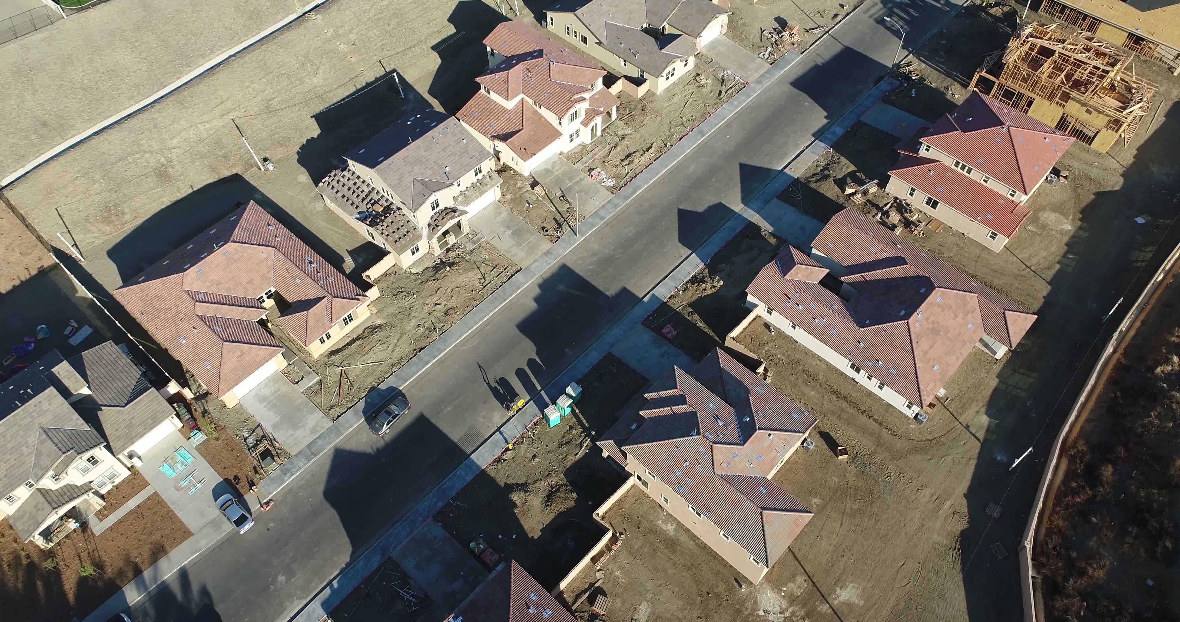 High Definition 4k Pan Up Over New and Developed Home Construction