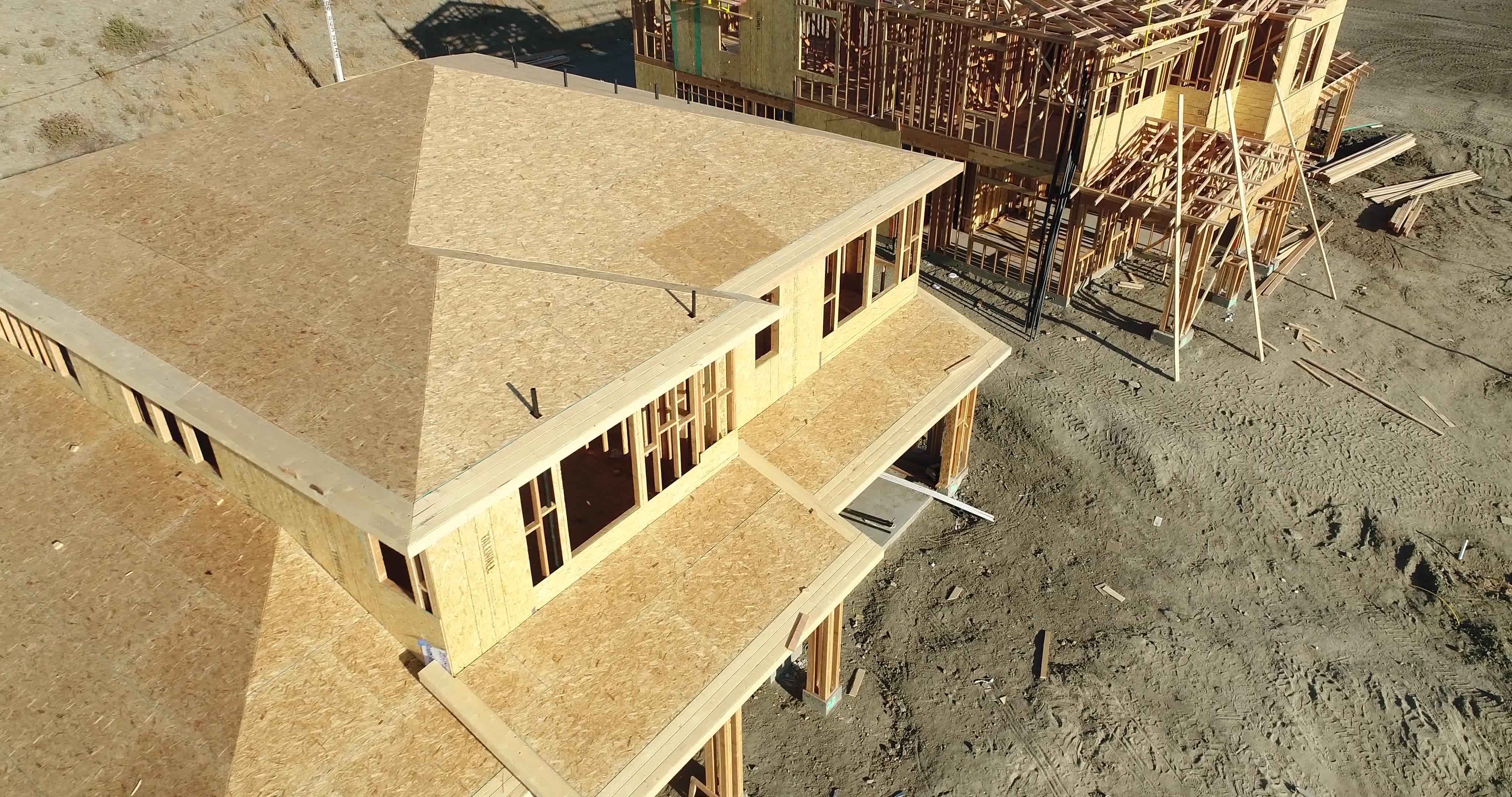 High Definition 4k Pan Down Over and Past New Home Construction Sites