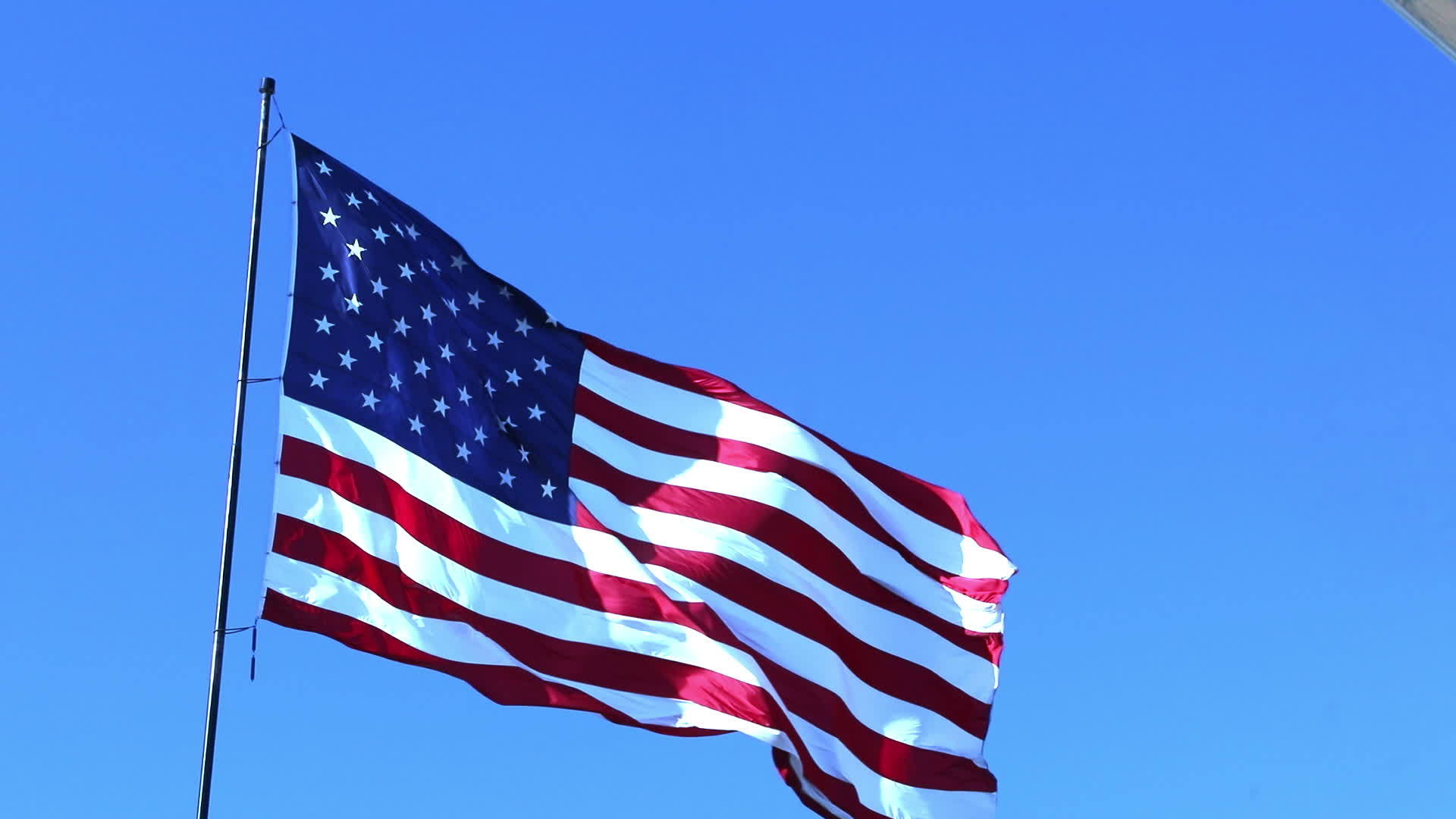 Ghosted American Flag Waving Slow Motion With Home Construction Wood