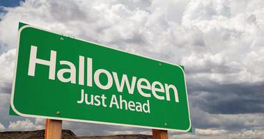 4K Time lapse Halloween Just Ahead Green Road Sign and Stormy Cumulus Clouds video