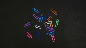 Paper clip isolated on a black background photo