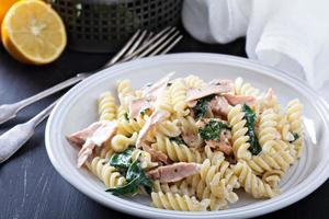 Pasta fusilli with baked salmon and spinach photo