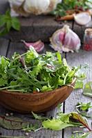 Green salad leaves in a wooden bowl photo