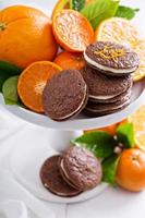 Chocolate orange cookies with cream filling photo