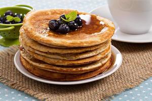 Stacked pancakes with berries photo