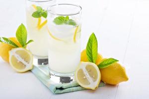 Fresh homemade lemonade in tall glasses photo