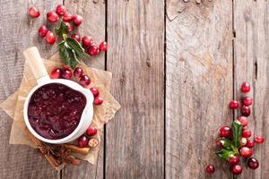 Cranberry sauce in ceramic saucepan photo