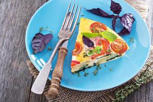 Frittata with tomatoes, herbs and potatoes photo