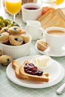 Fresh and bright continental breakfast table photo