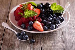 Variety of summer berries on a plate photo