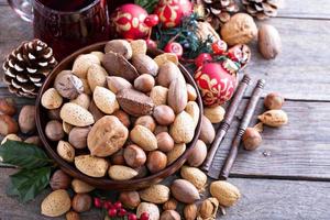 Variety of nuts with shells in a bowl photo