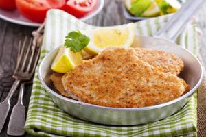 Pork schnitzel with parmesan photo