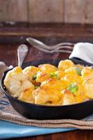 Cauliflower with cheese baked in a pan photo