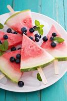 Watermelon popsicles with blueberry photo