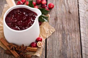 Cranberry sauce in ceramic saucepan photo