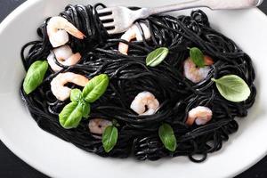 Squid ink homemade pasta with shrimp photo