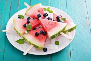 Fresh watermelon popsicles with blueberries photo