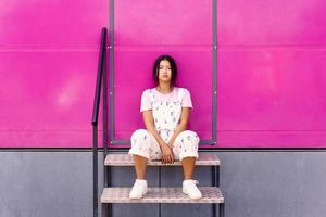 Asian woman sitting on steps photo