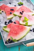 Watermelon slices on ice photo