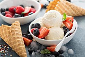 Vanilla ice cream scoops with berries photo