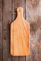 Wooden rustic background with a cutting board photo