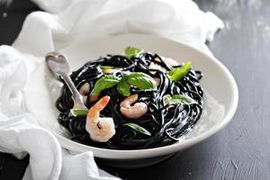 Squid ink homemade pasta with shrimp photo