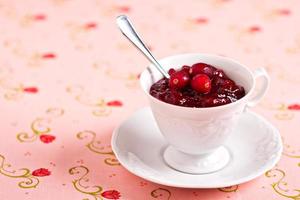 Homemade cranberry sauce in a cup, holiday recipe photo