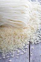 Dry rice and noodles on the table photo