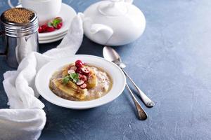 Multigrain porridge with bananas and cranberry photo