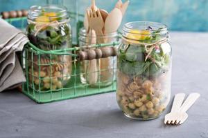 Assembling a mason jar salad photo